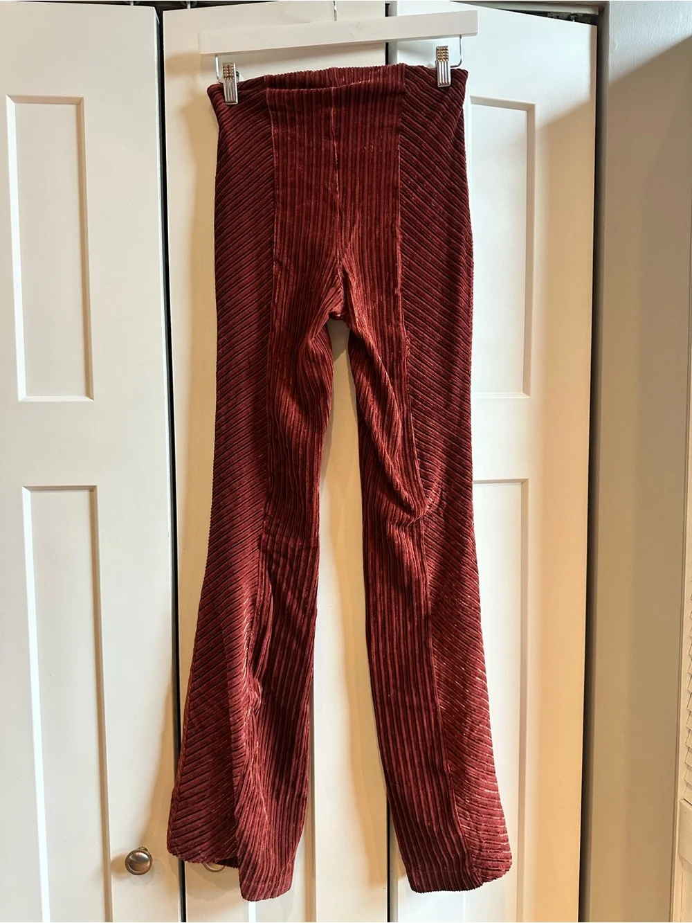 Free People Ribbed Velvet Flare Pants in Rust Red